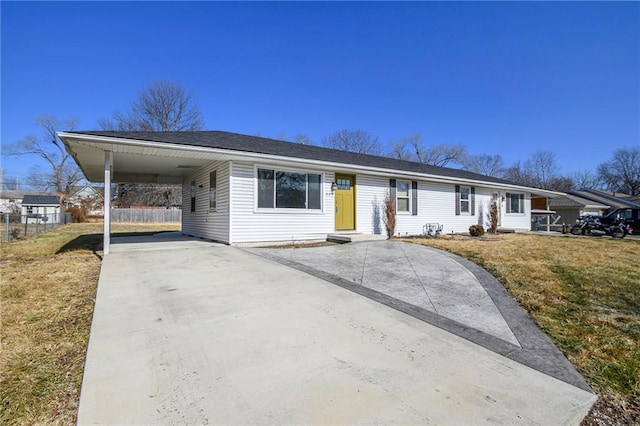 single story home featuring a front lawn and a carport