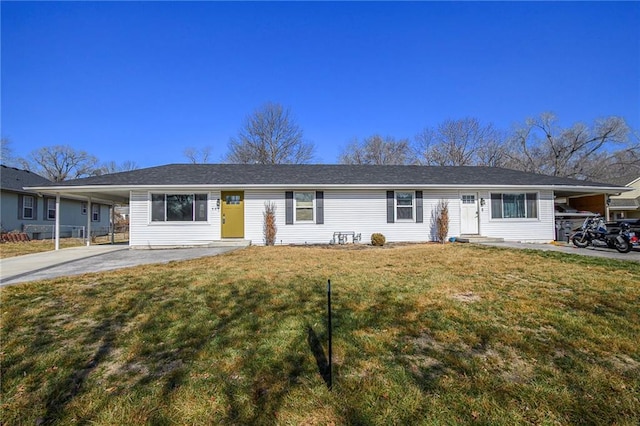 ranch-style home featuring a carport and a front yard