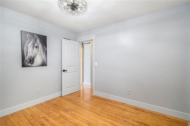 unfurnished room featuring light hardwood / wood-style floors