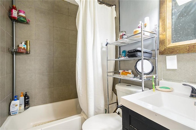 full bathroom featuring toilet, sink, and shower / bath combo with shower curtain