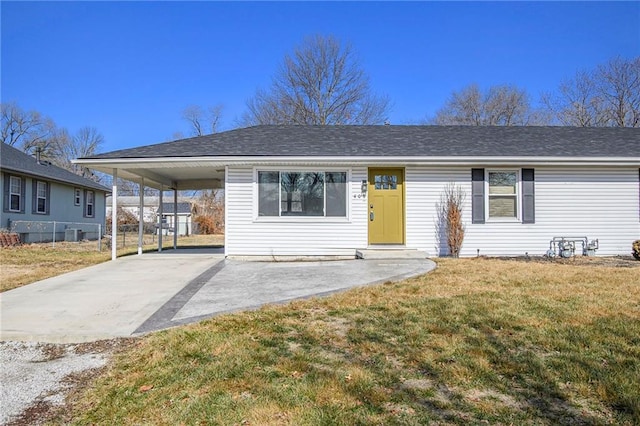 view of front of house with central AC unit, a front lawn, and a carport