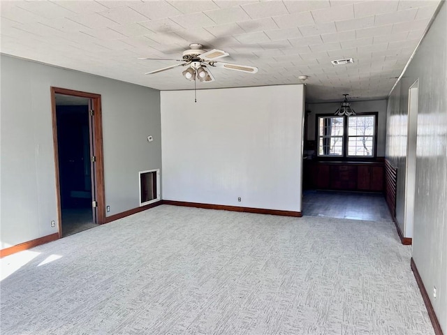 unfurnished room featuring light carpet and ceiling fan