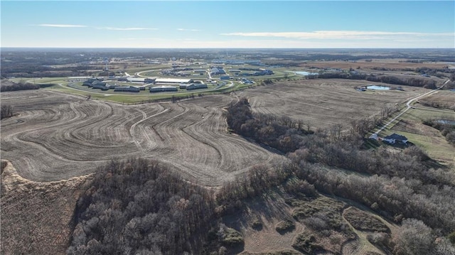 birds eye view of property featuring a rural view