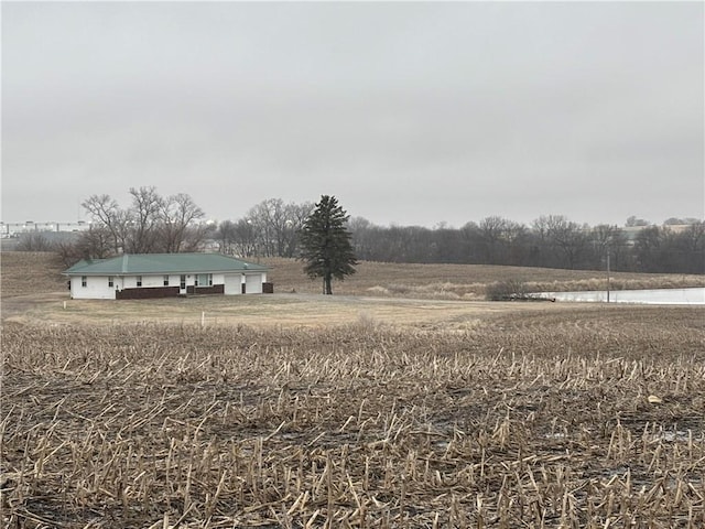 view of yard featuring a water view and a rural view