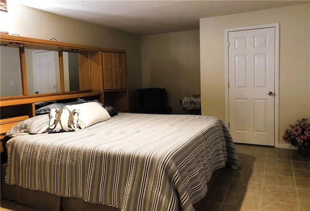 bedroom featuring tile patterned flooring