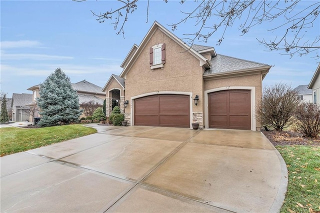 view of front of home featuring a garage and a front lawn