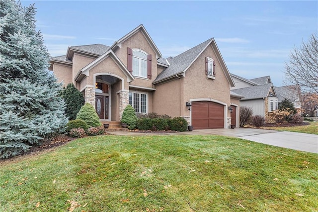 view of front of property featuring a garage and a front yard