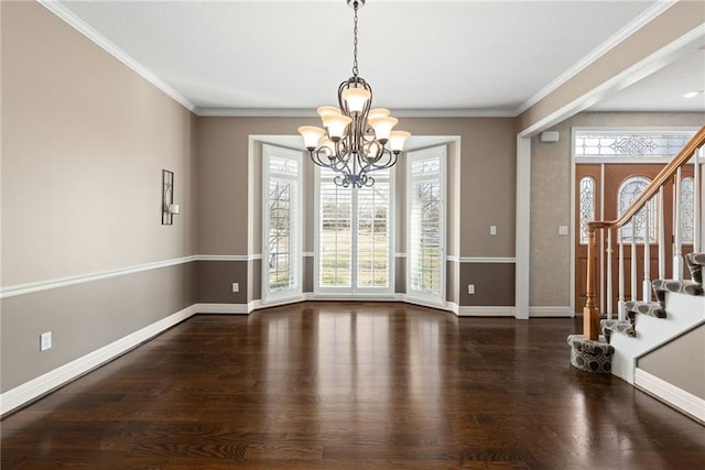 interior space with stairs, wood finished floors, baseboards, and a chandelier