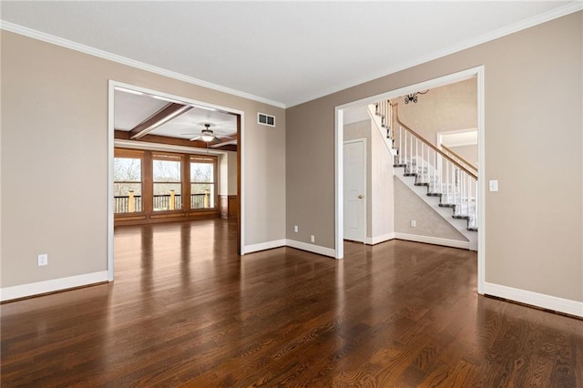 unfurnished room featuring wood finished floors, baseboards, visible vents, ceiling fan, and stairs