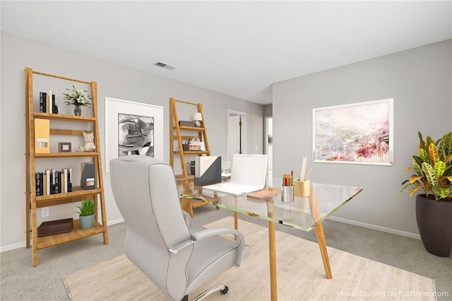 office area featuring carpet, visible vents, and baseboards