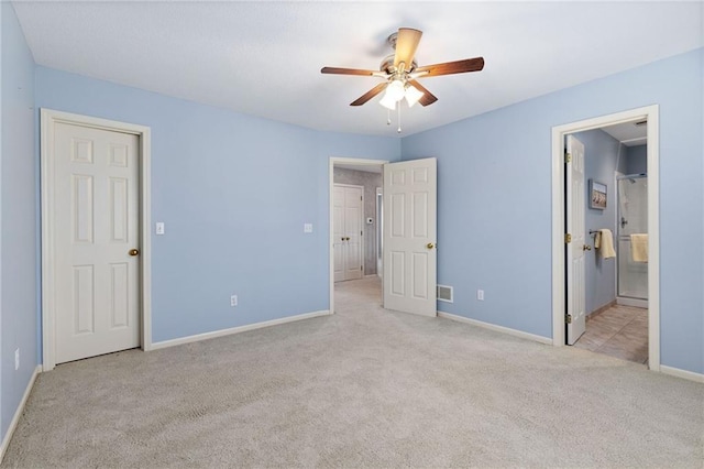 unfurnished bedroom with visible vents, connected bathroom, ceiling fan, baseboards, and carpet floors