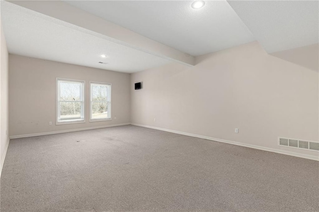 carpeted spare room with beamed ceiling, recessed lighting, visible vents, and baseboards