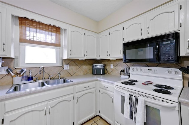 kitchen with white cabinetry, sink, electric range, and decorative backsplash