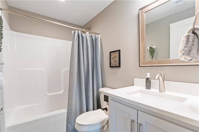 full bathroom with shower / tub combo with curtain, vanity, and toilet