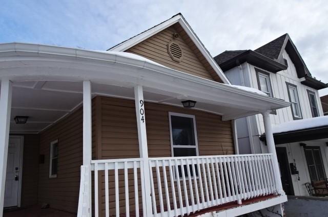 view of property exterior with a porch