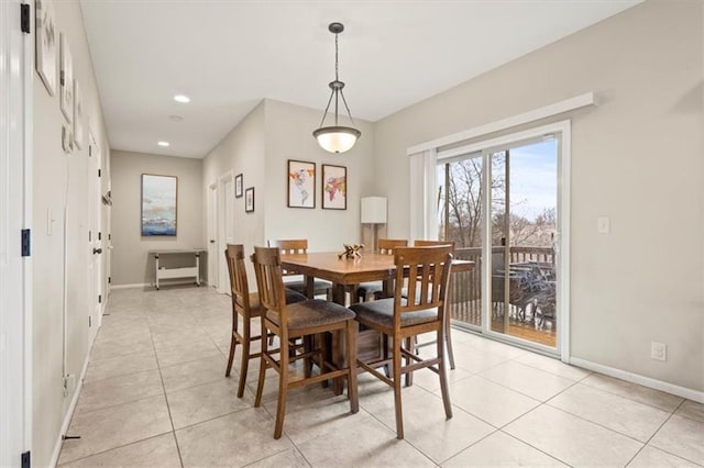 dining space featuring light tile patterned floors