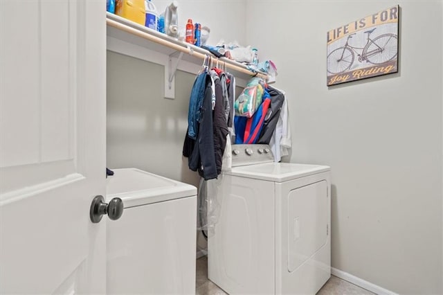 clothes washing area featuring independent washer and dryer