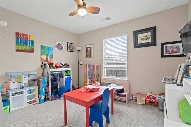 playroom featuring carpet floors and ceiling fan