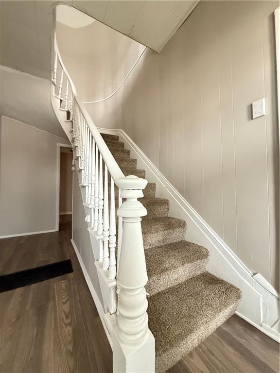 stairs with wood finished floors