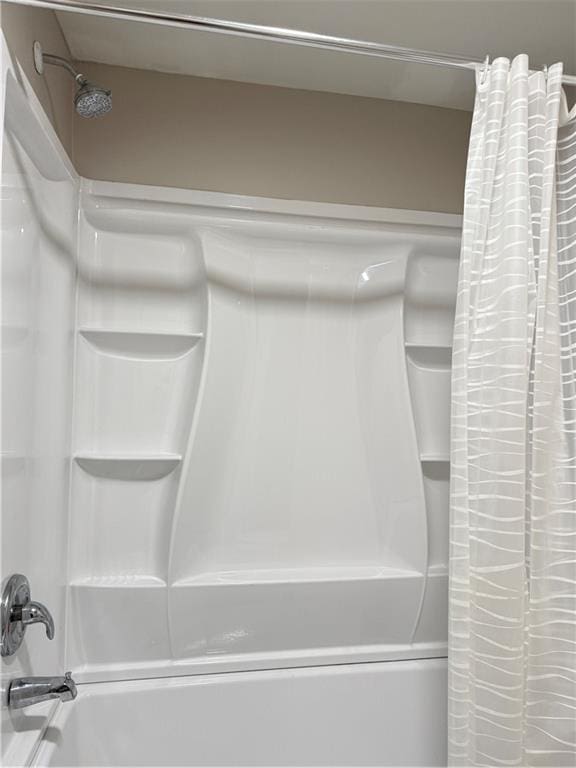 full bathroom featuring shower / bathtub combination with curtain