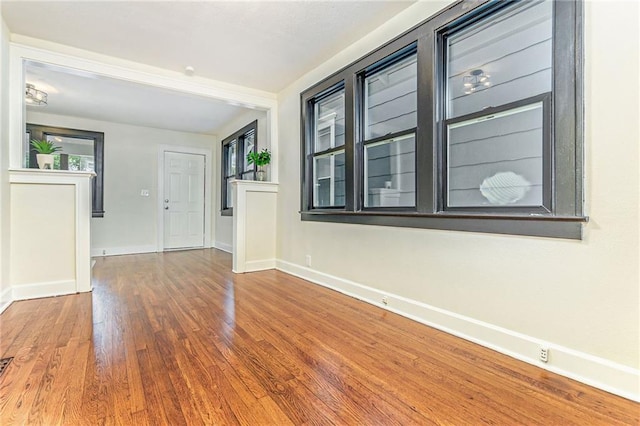 spare room with hardwood / wood-style floors