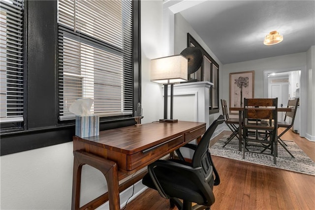 home office with hardwood / wood-style flooring