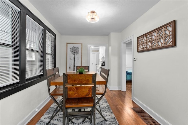 dining space featuring hardwood / wood-style flooring