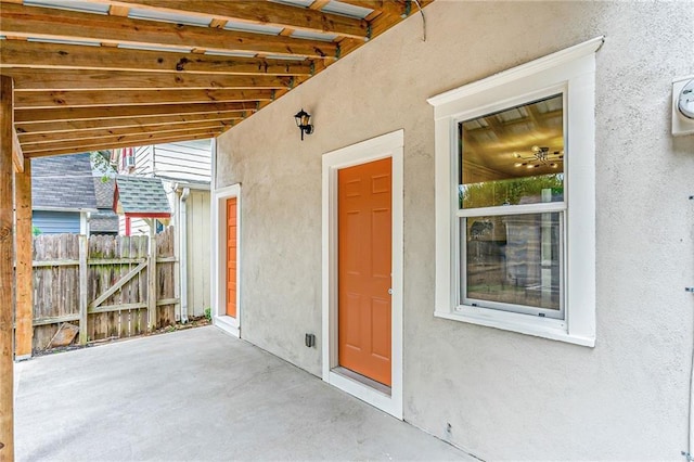 entrance to property with a patio