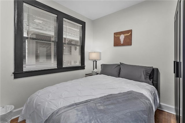 bedroom featuring dark hardwood / wood-style floors