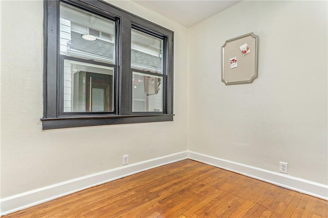 unfurnished room featuring hardwood / wood-style floors