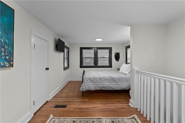 bedroom with hardwood / wood-style floors