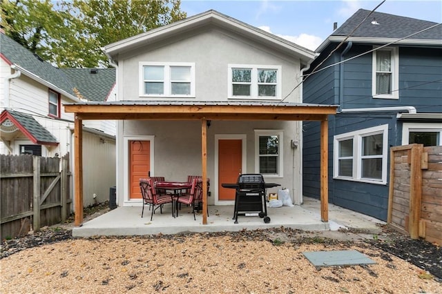 rear view of property with a patio area