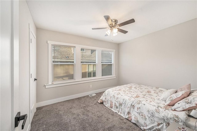 bedroom with ceiling fan and carpet flooring