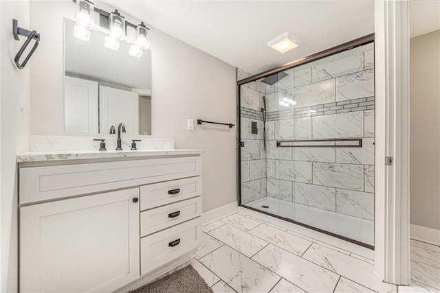 bathroom with vanity and a shower with door