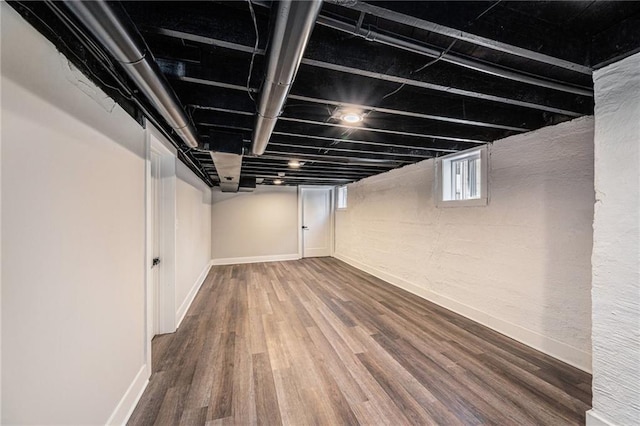 basement with wood-type flooring