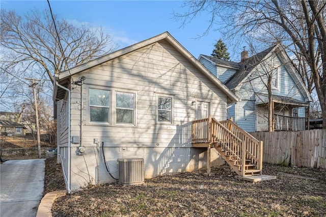 back of house featuring central AC