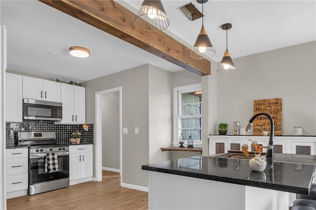 kitchen featuring white cabinetry, tasteful backsplash, decorative light fixtures, stainless steel appliances, and beam ceiling