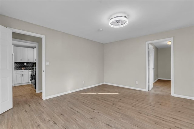 spare room with light hardwood / wood-style flooring