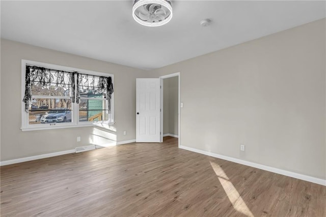 empty room featuring hardwood / wood-style flooring