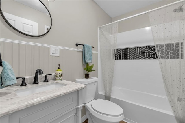 full bathroom featuring vanity, toilet, and shower / bath combo with shower curtain