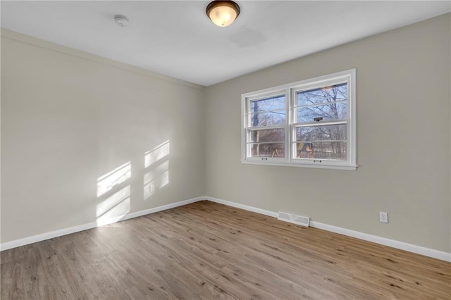 empty room with light wood-type flooring