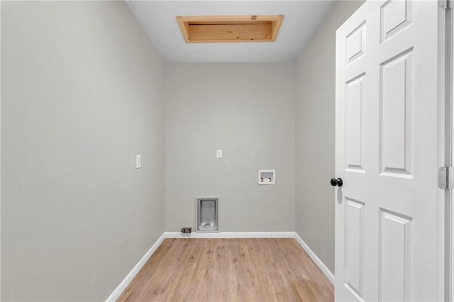 laundry area with washer hookup and light hardwood / wood-style flooring