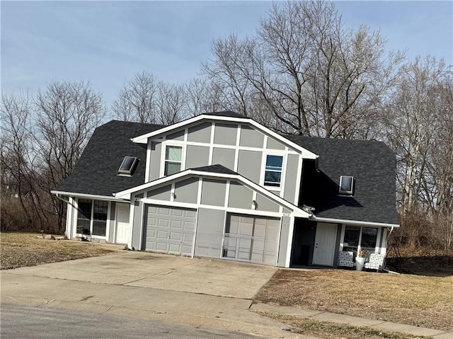 tudor-style house featuring a garage