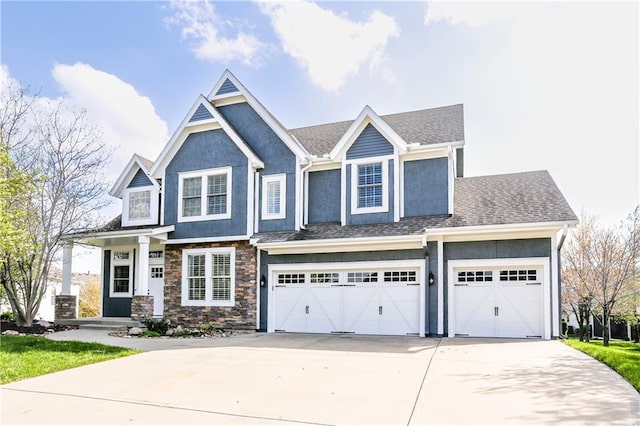 9609 NE 96th Ter, Kansas City, MO 64157 - craftsman-style home featuring a garage, driveway, stone siding, and stucco siding