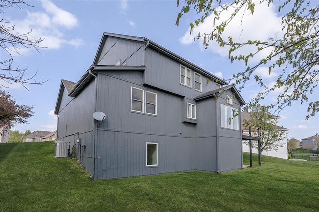 9609 NE 96th Ter, Kansas City, MO 64157 - view of side of home with central AC unit and a yard