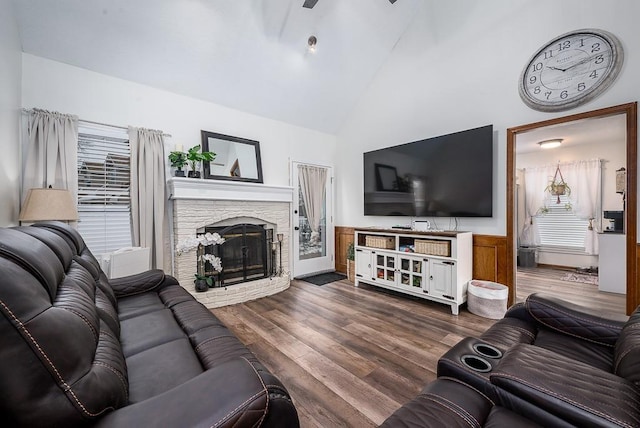 living room with high vaulted ceiling and dark wood-type flooring