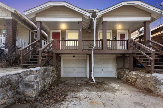 view of front facade featuring a garage and covered porch