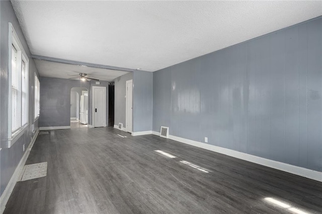 unfurnished room featuring dark hardwood / wood-style flooring and ceiling fan