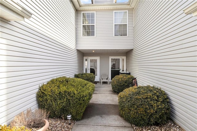 view of exterior entry with covered porch