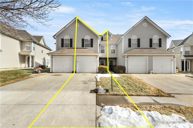 traditional-style house with concrete driveway